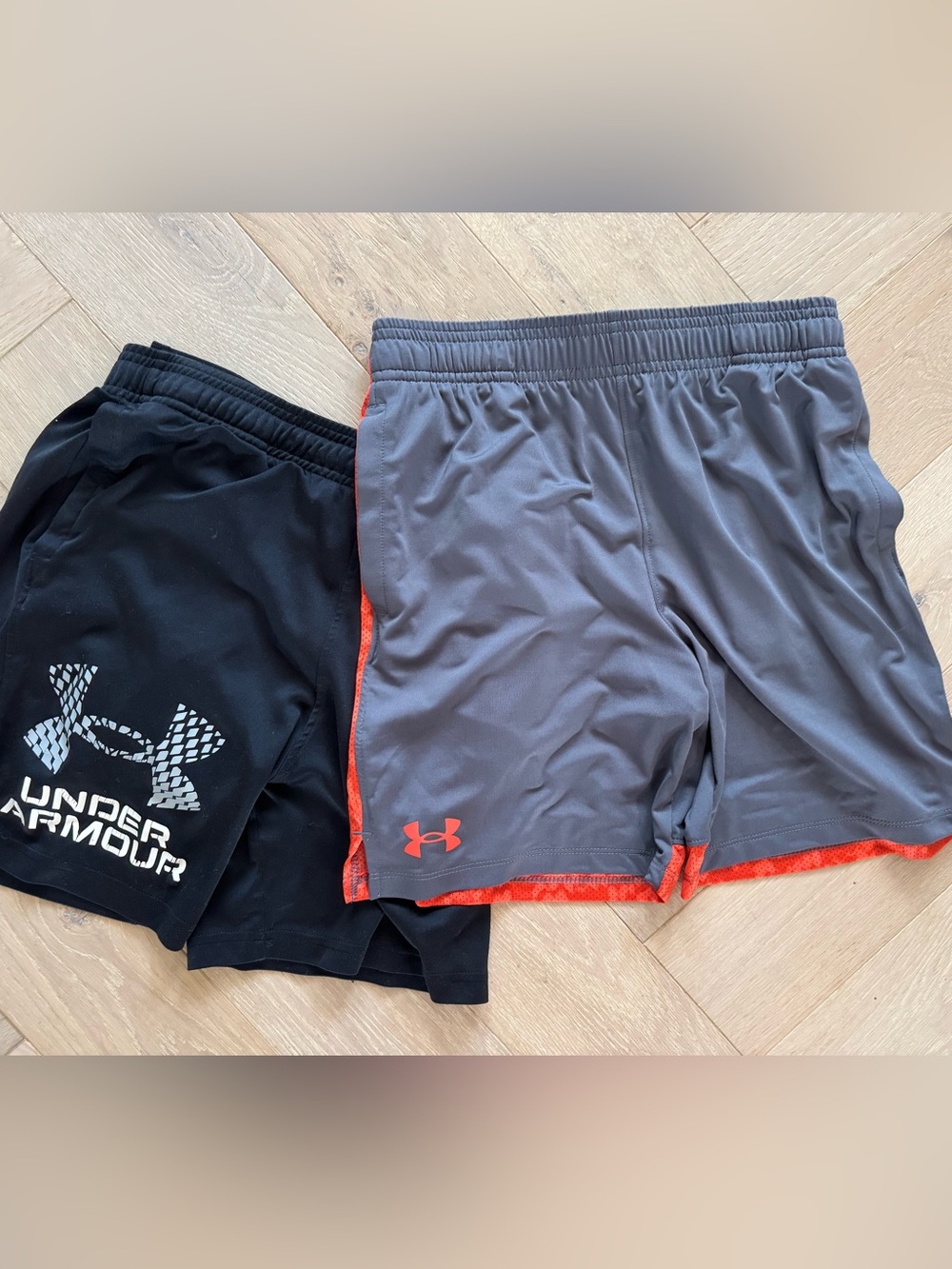 2 pairs of Under Armour Boy's Performance Shorts - Gray with Orange Trim/ Black
